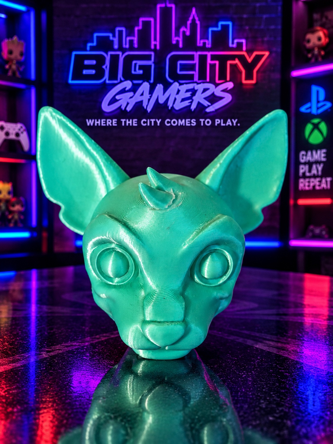 Teal creature 3D-printed desk mate at Big City Gamers
