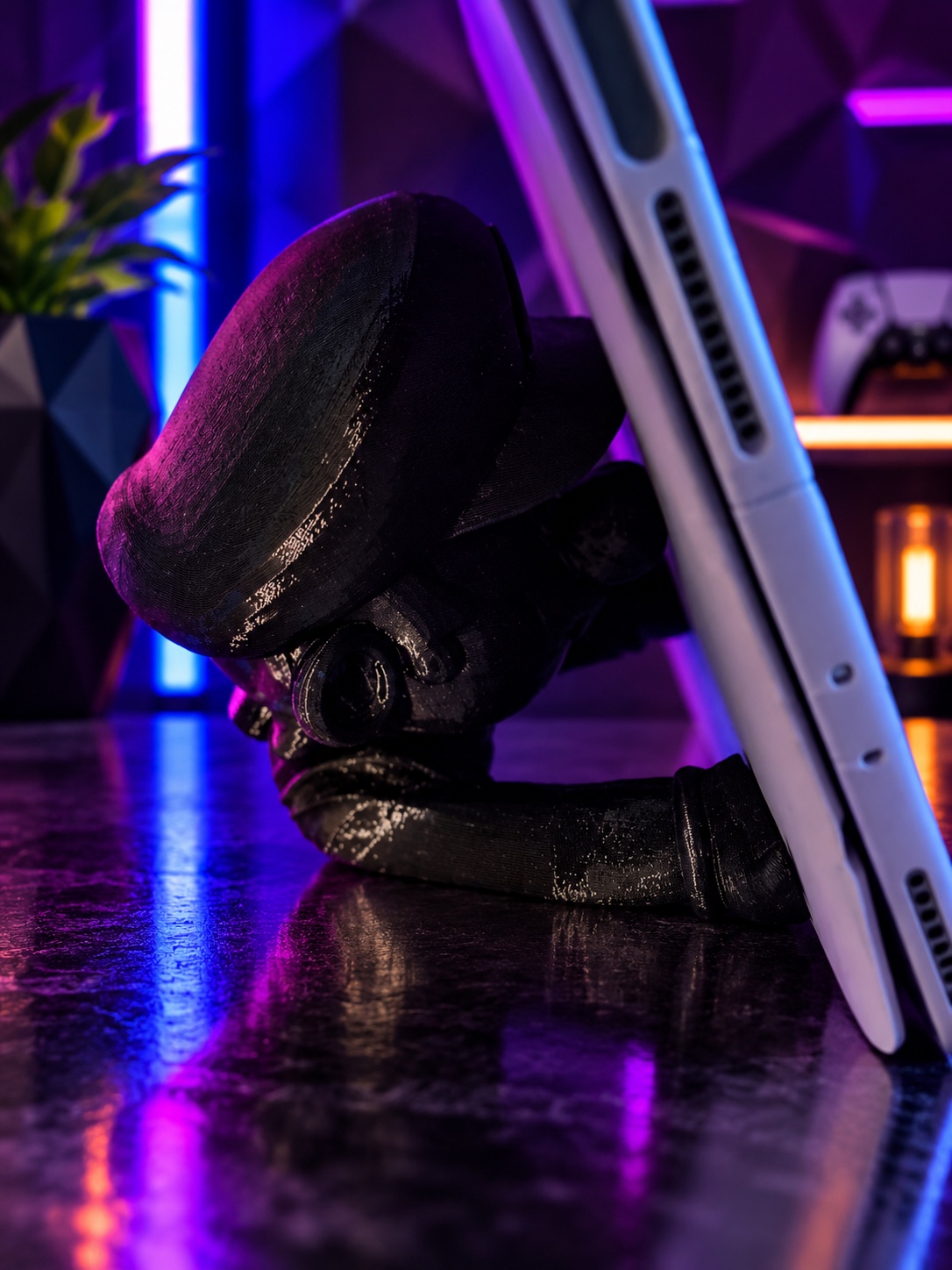 Character 3D-printed desk mate holding a tablet